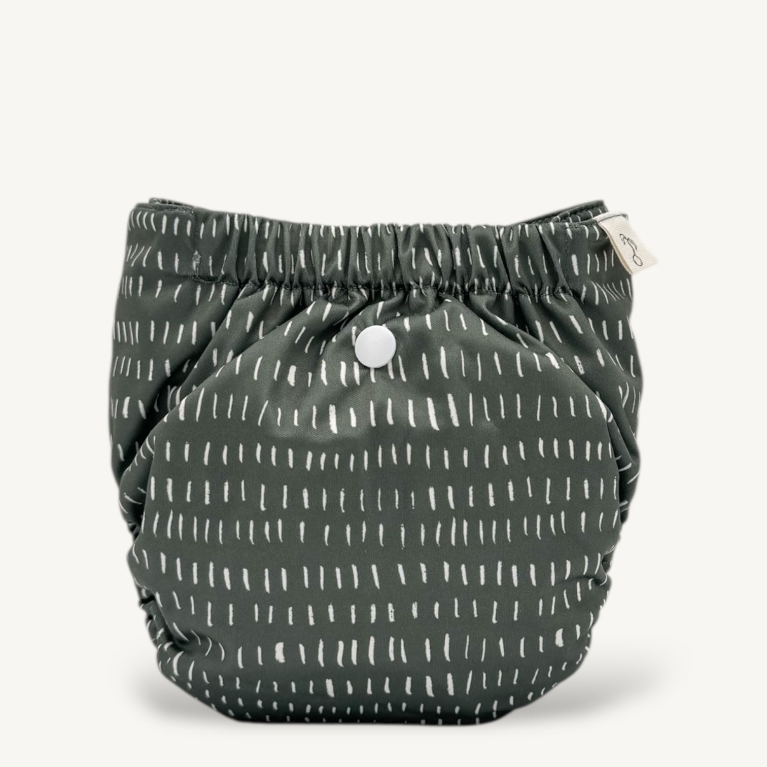 green diaper with white pattern on a white background