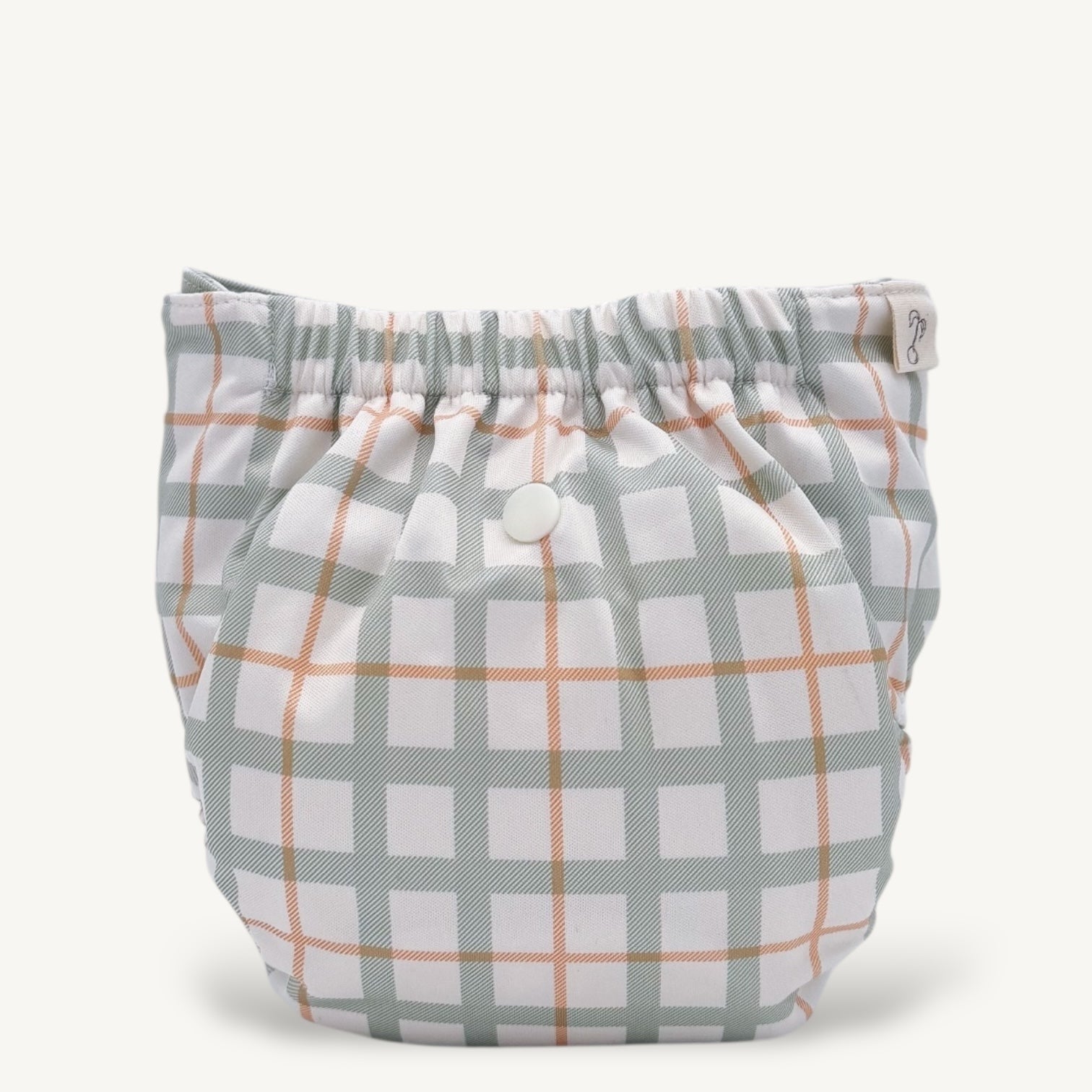 Plaid-patterned diaper cover on a white background
