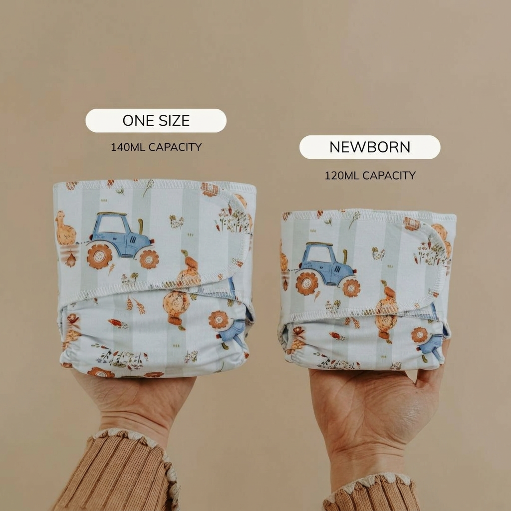 Two reusable diapers held by hands with text indicating size and capacity on a beige background.